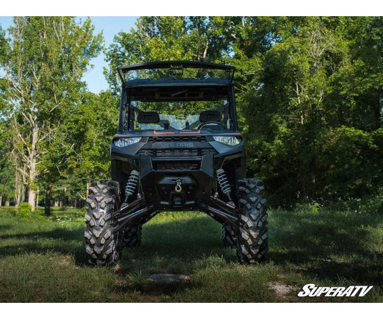 Straight-on front view of the lifted Polaris Ranger XP 1000 on the SuperATV 6-inch lift kit in a grass clearing