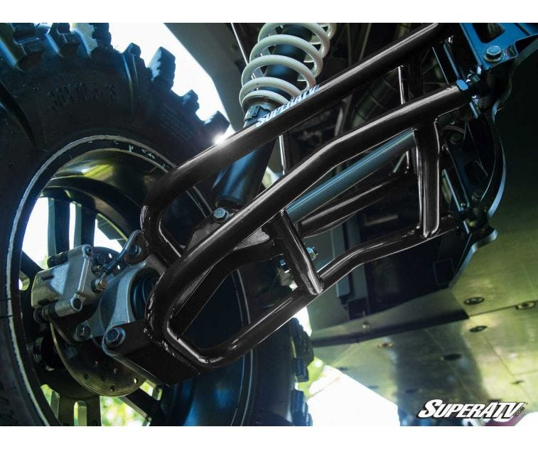 SuperATV tubular rear control arms installed on the Ranger XP 1000 with shock and mud tire, view from below