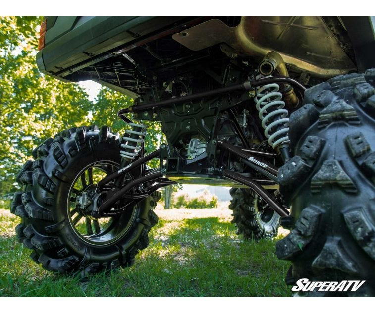 Rear underside view of the lifted Polaris Ranger XP 1000 showing SuperATV control arms, shocks and axles