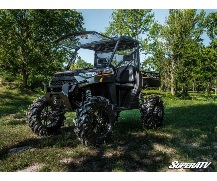SuperATV 6 inch lift kit installed on a black Polaris Ranger XP 1000 with roof and oversized mud tires