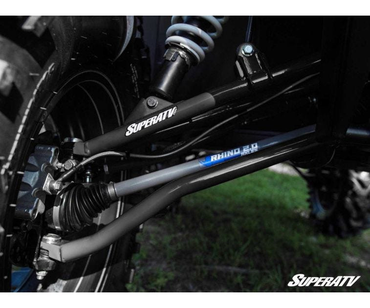 Close-up of a SuperATV branded A-arm and blue-labeled axle on a Ranger XP 1000 with the 6 inch lift kit