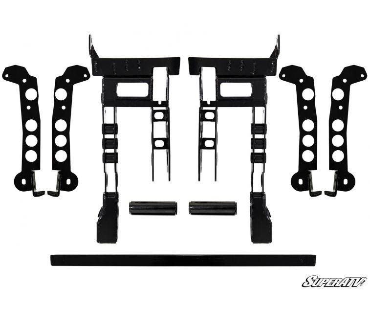 Front subframe drop brackets and crossmember pieces from the SuperATV Can-Am Commander 6-inch lift kit on white