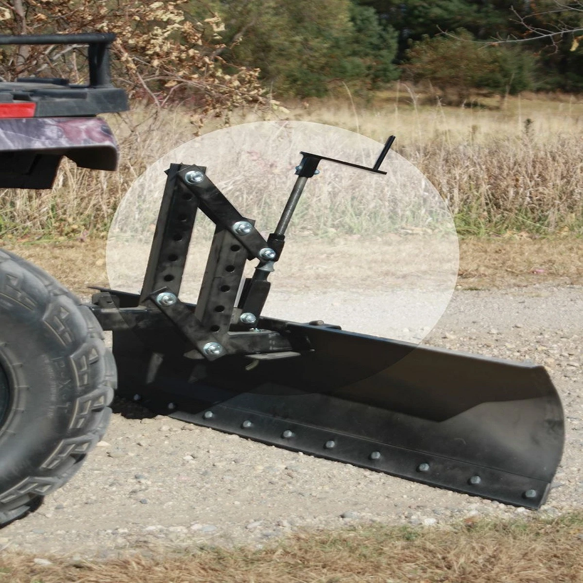 Moto Alliance IMPACT Pro lift mounted on the rear hitch of a camo ATV holding a grader blade on a gravel road