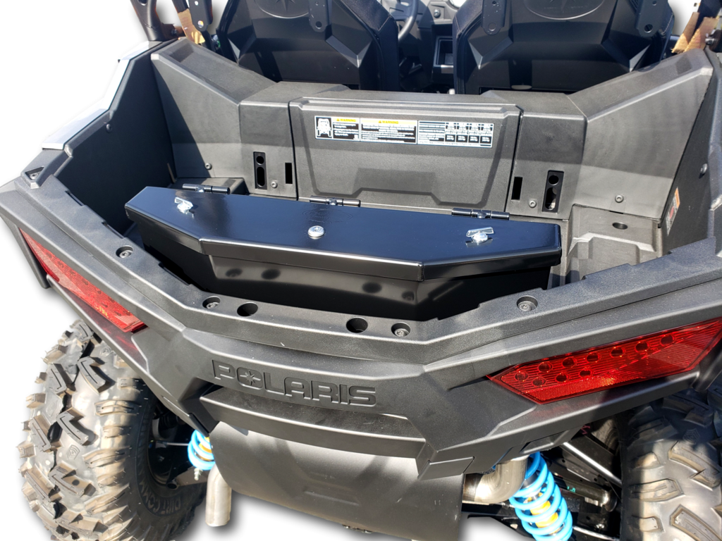 Hi-Standard cargo box with lid closed mounted in the rear bed of the Polaris RZR, angled view over the taillight