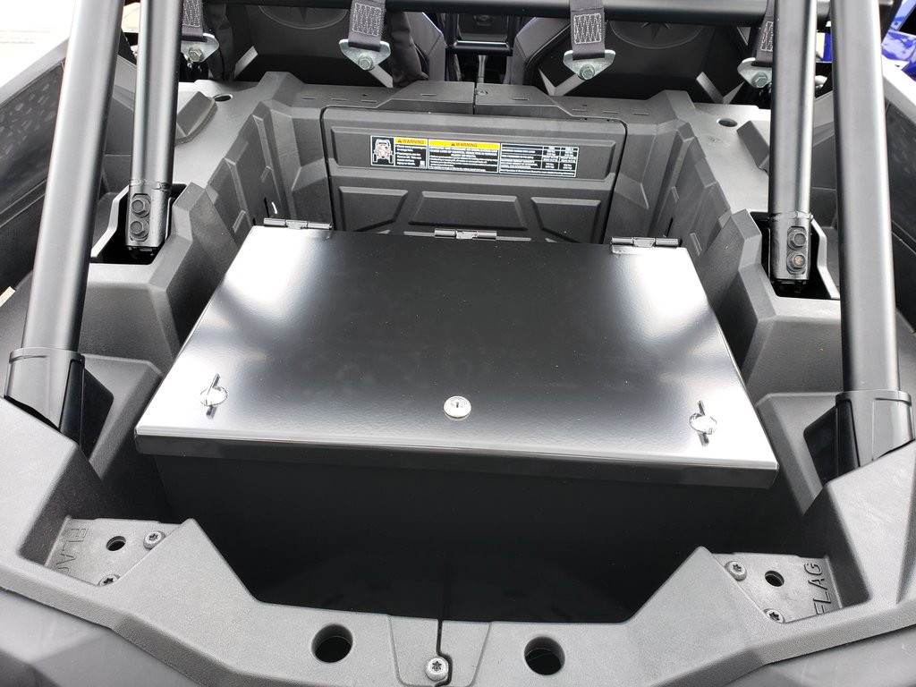 Hi-Standard rear cargo storage security box installed in the bed of a Polaris side-by-side, black lid closed, rear view