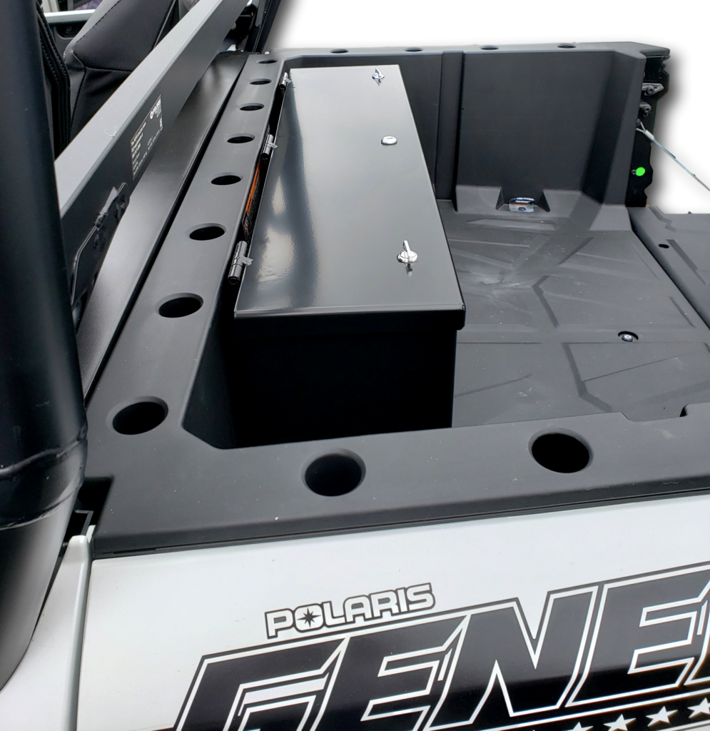 Hi-Standard black steel storage security box mounted at the front of a white Polaris General 1000 bed, lid closed