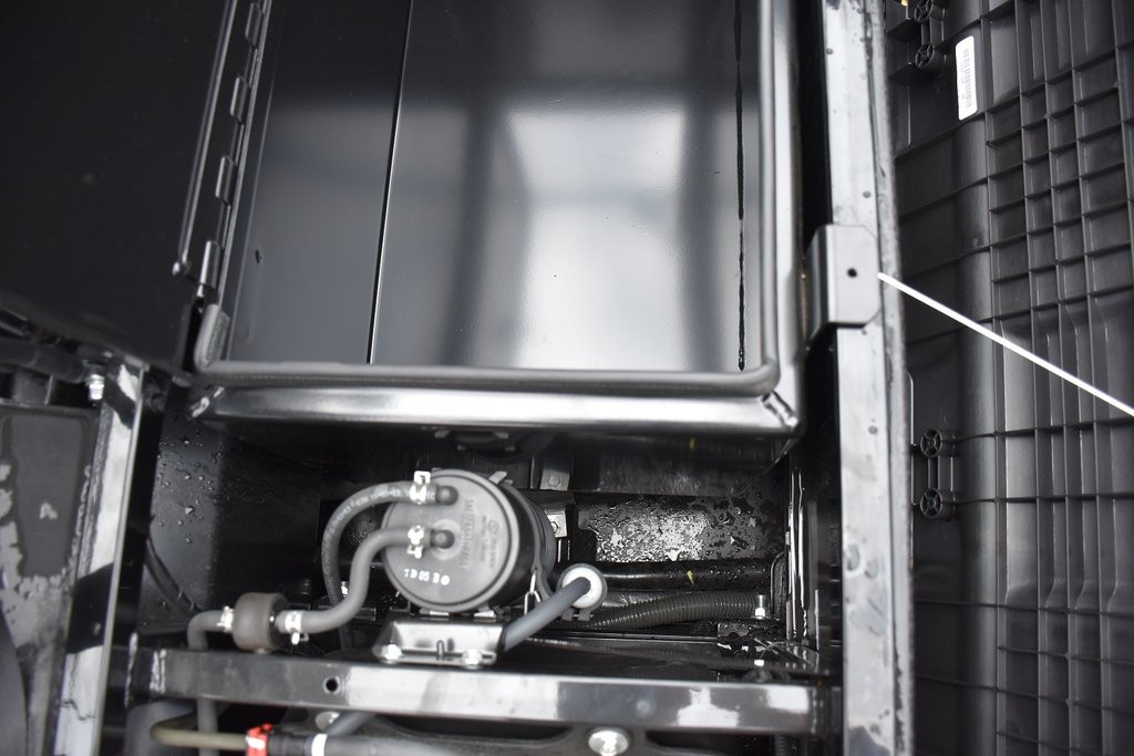 Hi-Standard under seat storage box installed in a Kawasaki Mule Pro FX with the seat removed, close-up