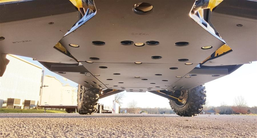 Underside view from behind of the Trail Armor full skid plate with mounting holes on a lifted Yamaha YXZ 1000R