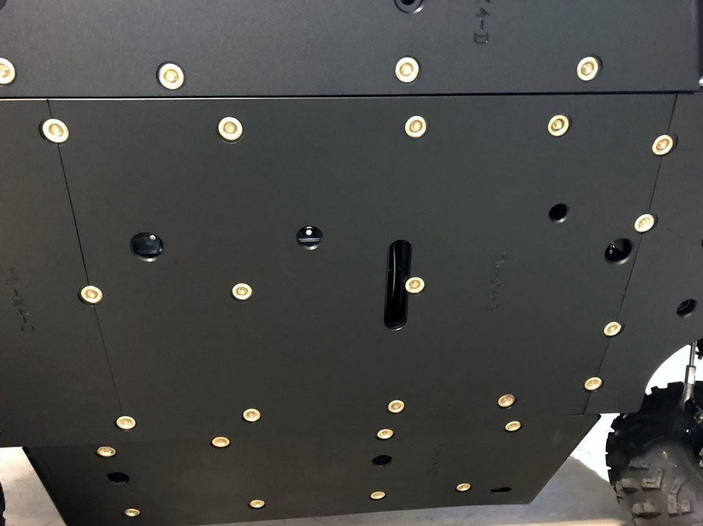Underside view of the Trail Armor full skid plate center section on a Yamaha Wolverine X4 with bolt pattern visible