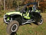 Side X Side upper doors on a green and black Honda Talon 2, front three-quarter view in a field
