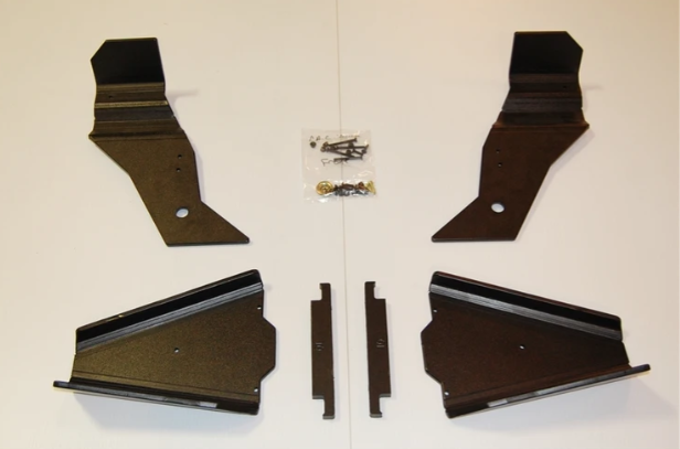 Trail Armor iMpact A-arm CV boot guards for a Can-Am Commander, four black plates and hardware laid out on white