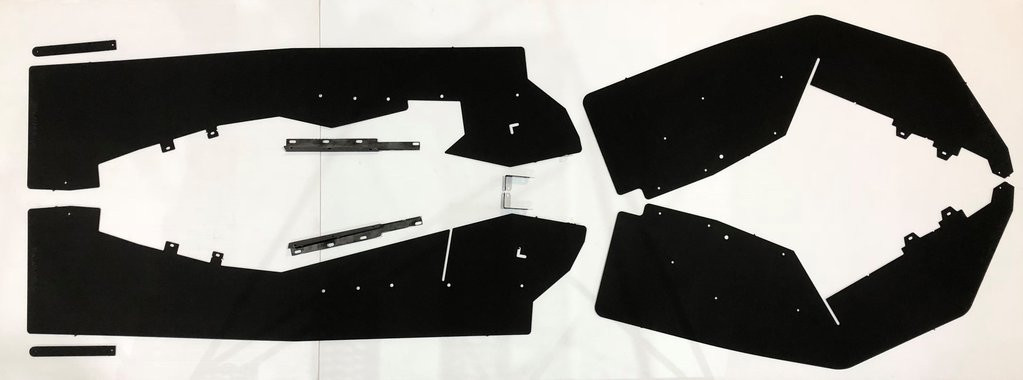 Trail Armor Honda Talon 1000 fender extensions kit laid flat: four black plastic mud flap panels with hardware