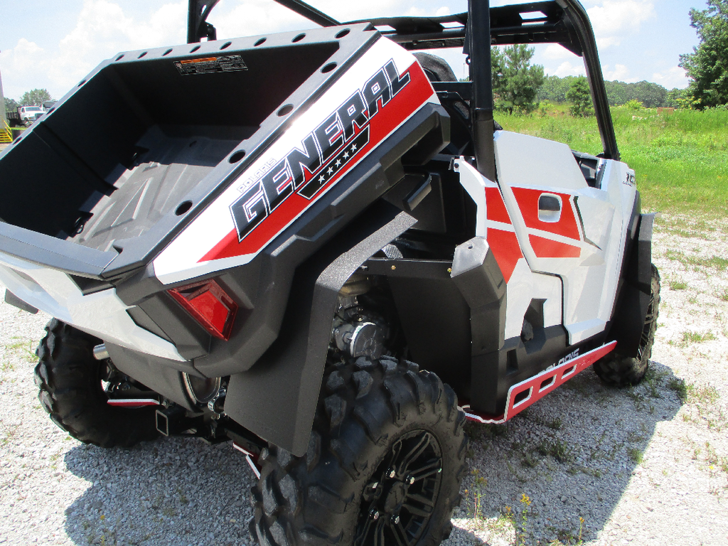 White and red Polaris General 1000 with the Trail Armor rear rack and tall bed extension, rear three-quarter view