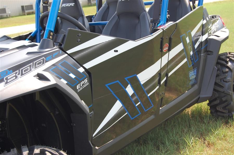 Trail Armor GenX doors installed on a black and blue Polaris RZR 800-4, side view of the front door on grass