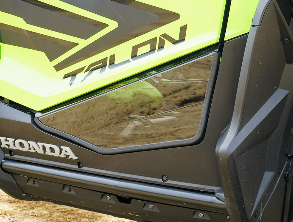 Spike door inserts for Honda Talon 2- and 4-seat: close-up of the tinted insert on a green Honda Talon door