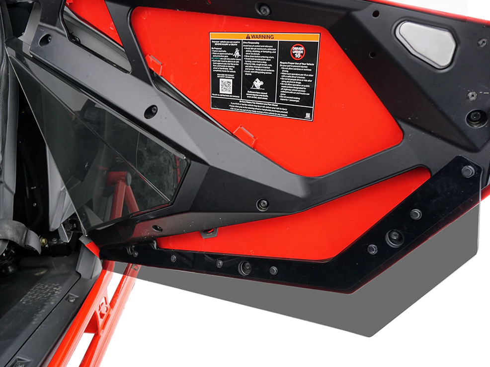 Close-up of the Spike Powersports dark tint door insert fitted in the red Polaris RZR Pro XP door frame