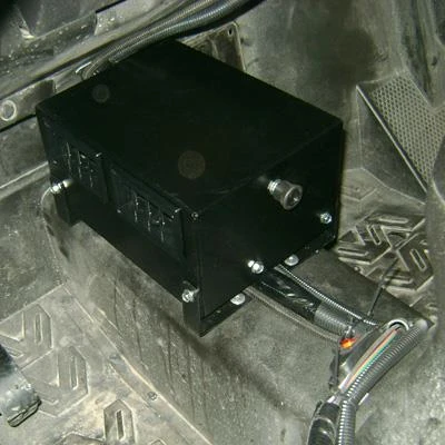 Universal Parts UTV cab heater box mounted under a dash with hoses and wiring attached, side view