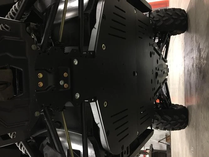 UPI UHMW skid plate installed under a Polaris Ranger XP 900/XP 1000, view from below showing the full plate