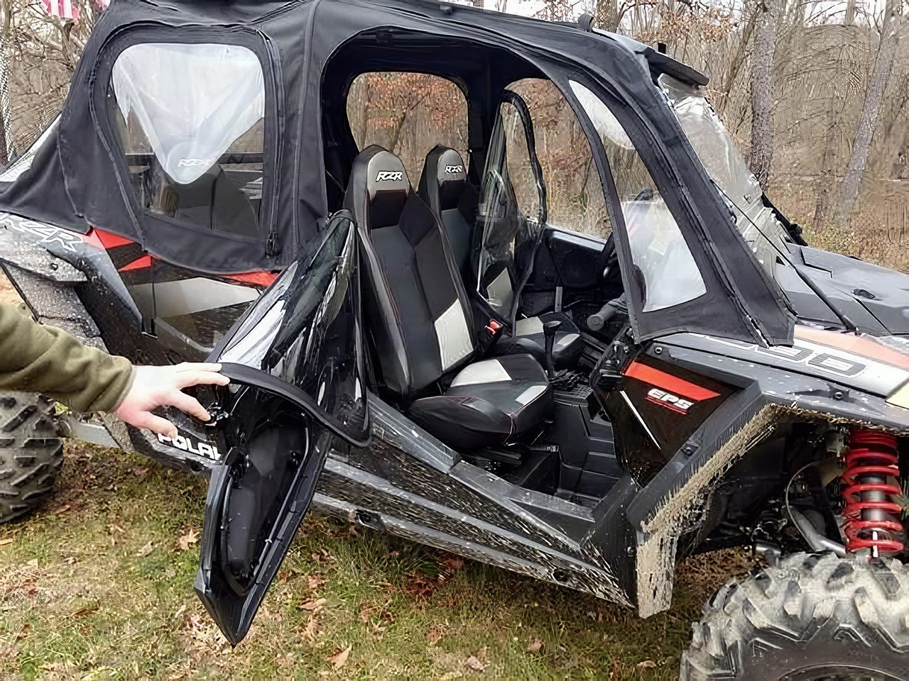 Side X Side soft upper doors on a Polaris RZR XP4 1000 with the front door held open by hand, side view