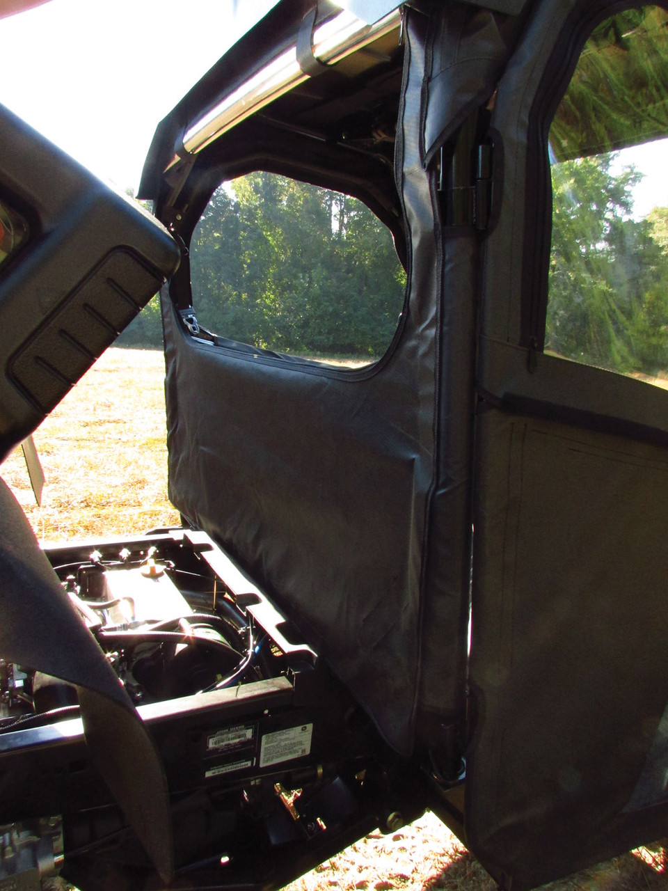 Inside view of the Seizmik back panel and door frame from the cab of a John Deere Gator XUV