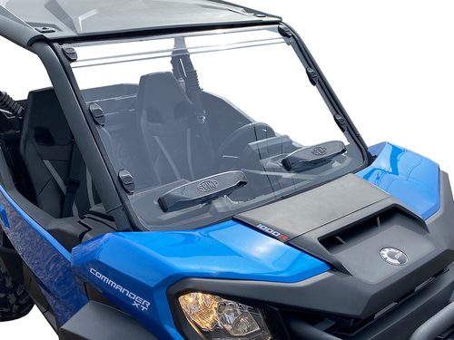 Close front three-quarter view of the Spike windshield showing its two round vents on a blue Can-Am Commander