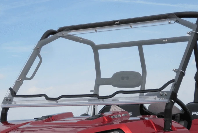 Seizmik folding windshield for the Bobcat 3400 in the upright position on the roll cage of a red side-by-side