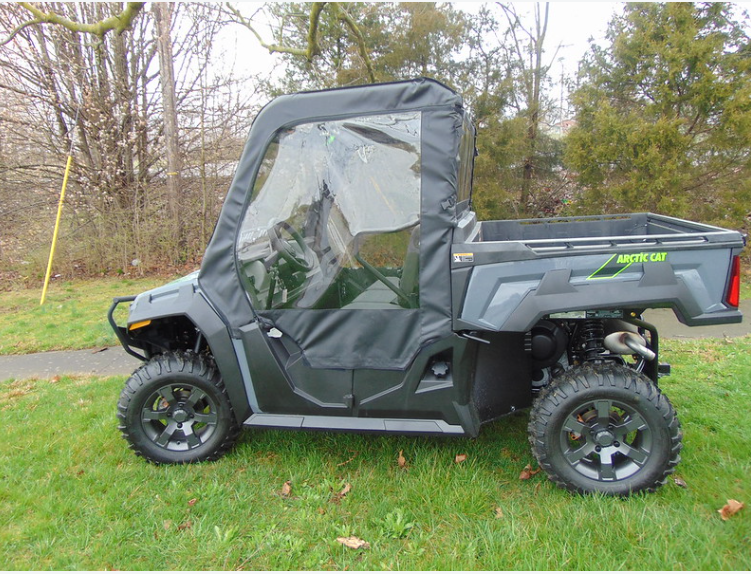 Side view of the gray Arctic Cat Prowler Pro with 3 Star soft doors and clear windows, angled slightly from the front