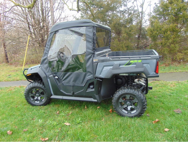 Straight side profile of the Arctic Cat Prowler Pro with the 3 Star enclosure doors and top, path and trees behind
