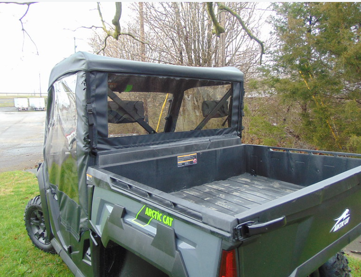 Close-up of the 3 Star soft rear window panel and door window above the cargo bed of an Arctic Cat Prowler Pro