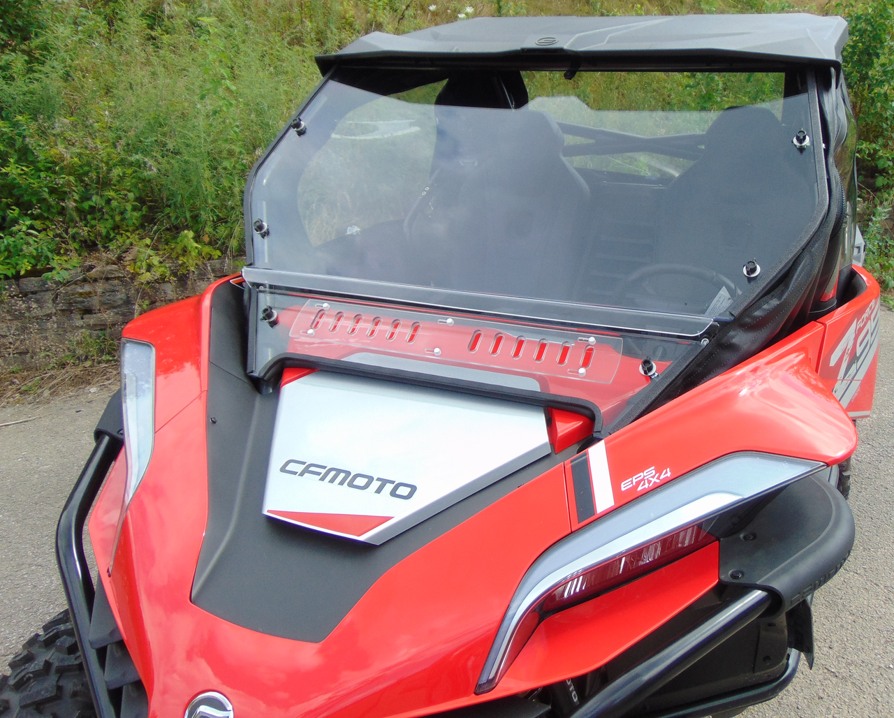 Front three-quarter view of the 3 Star 2-piece windshield and soft top on a red CF Moto ZForce 950