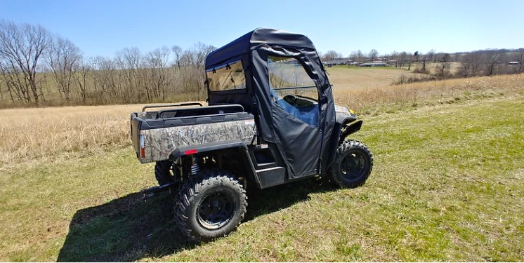 Hisun Sector with the 3 Star doors and rear window kit, three-quarter view from the driver side rear in a field