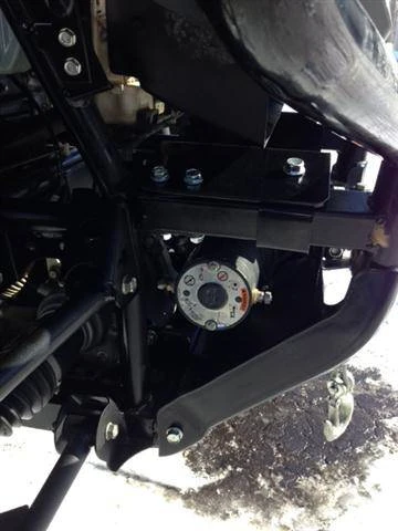 Extreme Metal Products winch mount installed under the front of a Honda Pioneer 700 with a winch bolted on