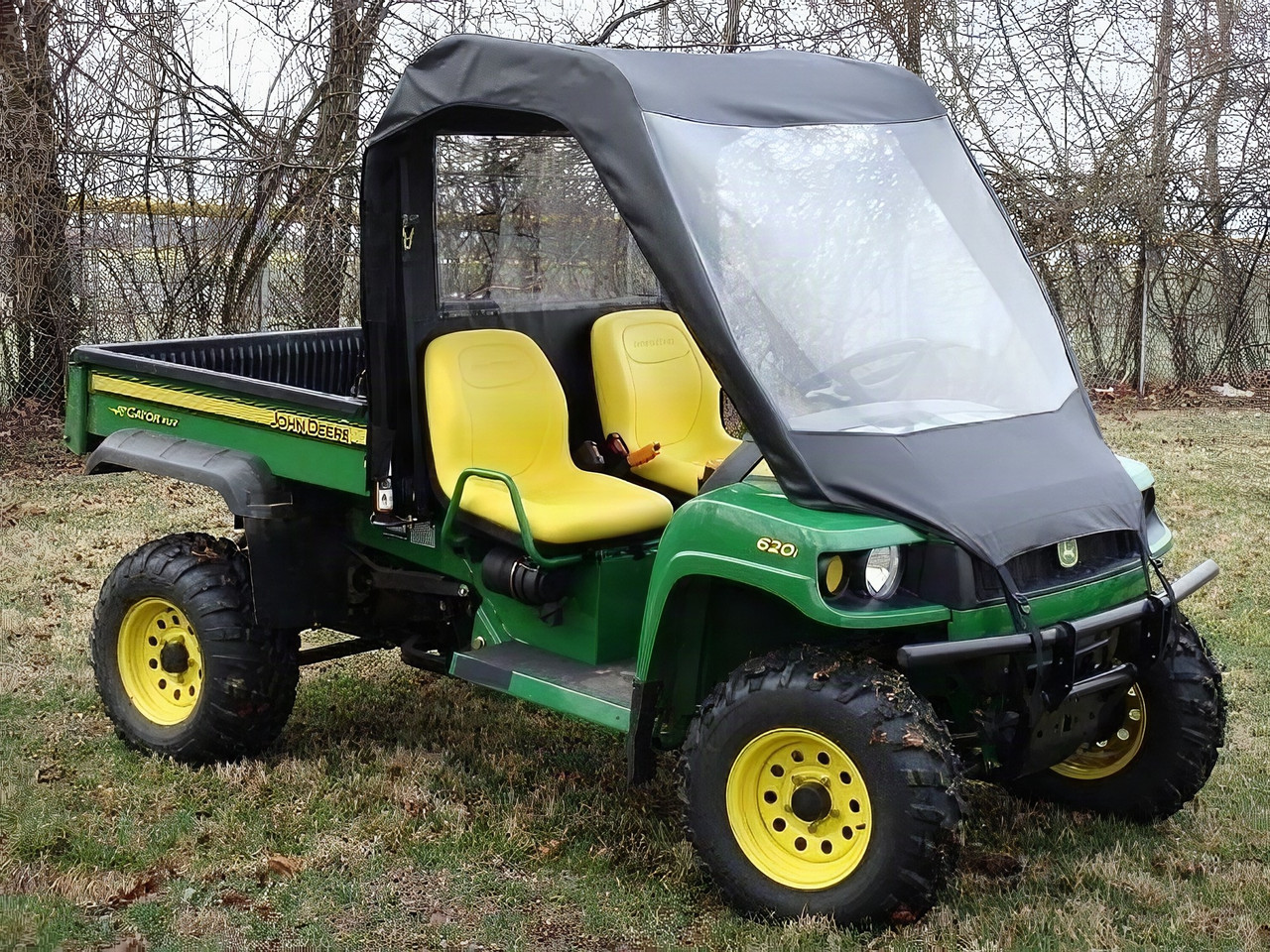 3 Star vinyl windshield, top and rear window combo on a green John Deere Gator XUV, front three-quarter view