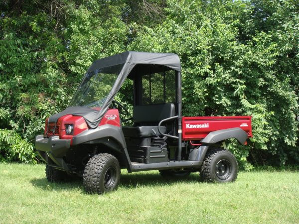 Passenger side three-quarter view of a red Kawasaki Mule 4010 with the 3 Star vinyl windshield and top