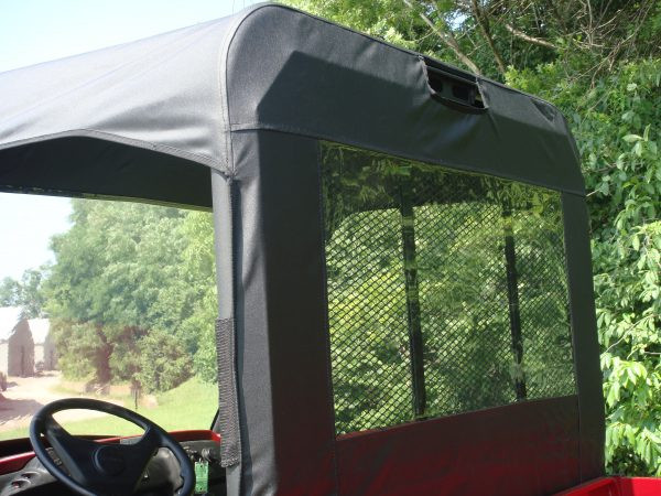View from the driver seat of the 3 Star clear vinyl rear window over the mesh cargo screen on a Kawasaki Mule 4010