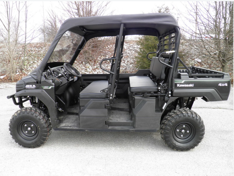 Driver side profile of a black Kawasaki Mule Pro with the 3 Star vinyl top over the front cab, rear seats open