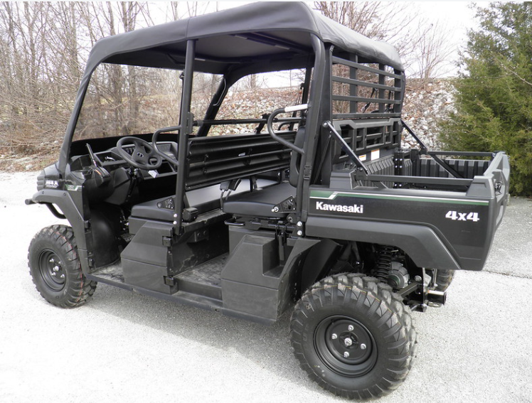 Passenger side view of a black Kawasaki Mule Pro with the 3 Star vinyl top and windshield, bed and cargo rack behind