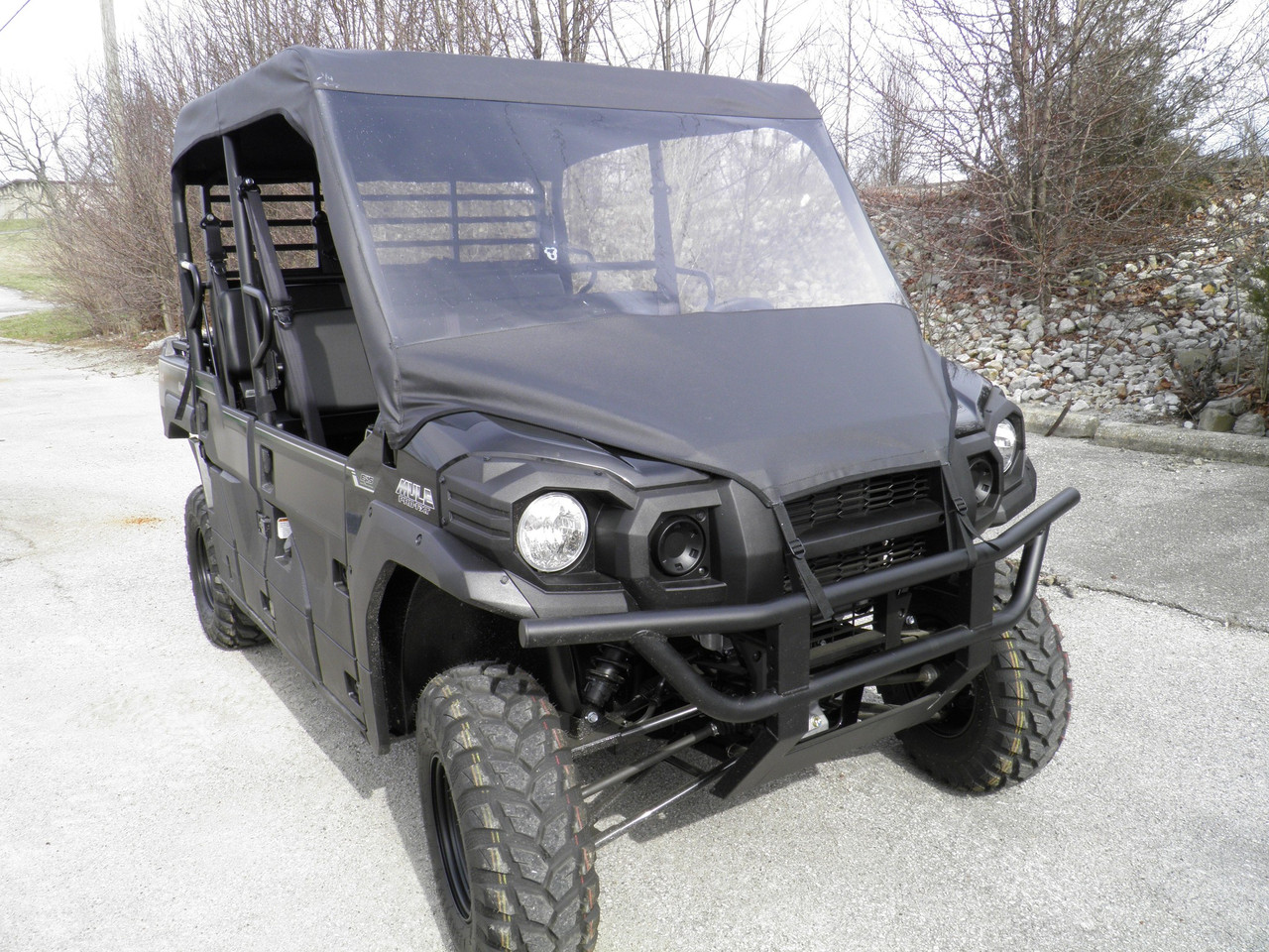 3 Star vinyl windshield and soft top on a black Kawasaki Mule Pro FXT, front 3/4 view on pavement