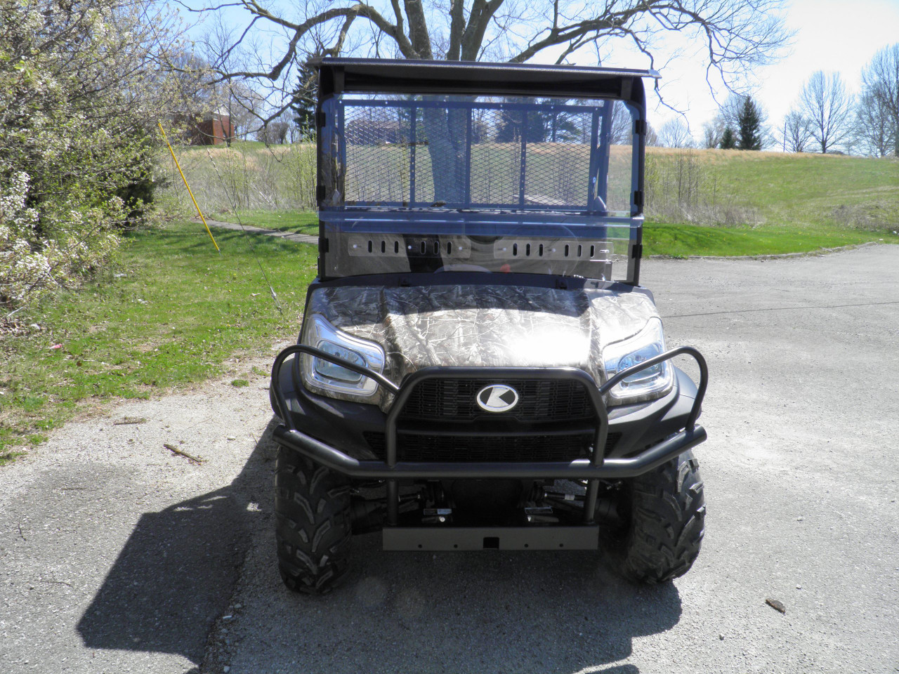 3 Star 2-piece scratch-resistant windshield installed on a black Kubota RTV X900, front view on a paved lot