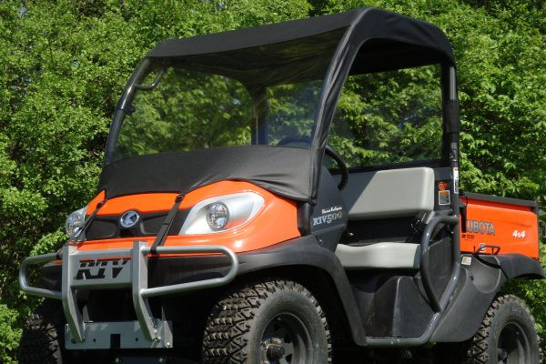 Front three-quarter view of an orange Kubota utility vehicle fitted with the 3 Star vinyl windshield and soft top