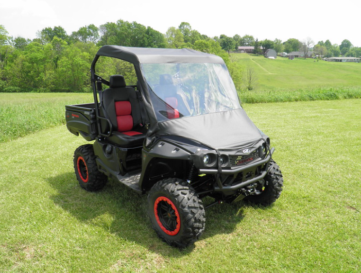 Front three-quarter view of the 3 Star vinyl windshield and top combo on a black side-by-side with red seats