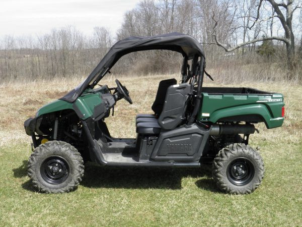 Side profile of a green Yamaha Viking wearing the 3 Star vinyl top and windshield, parked on grass