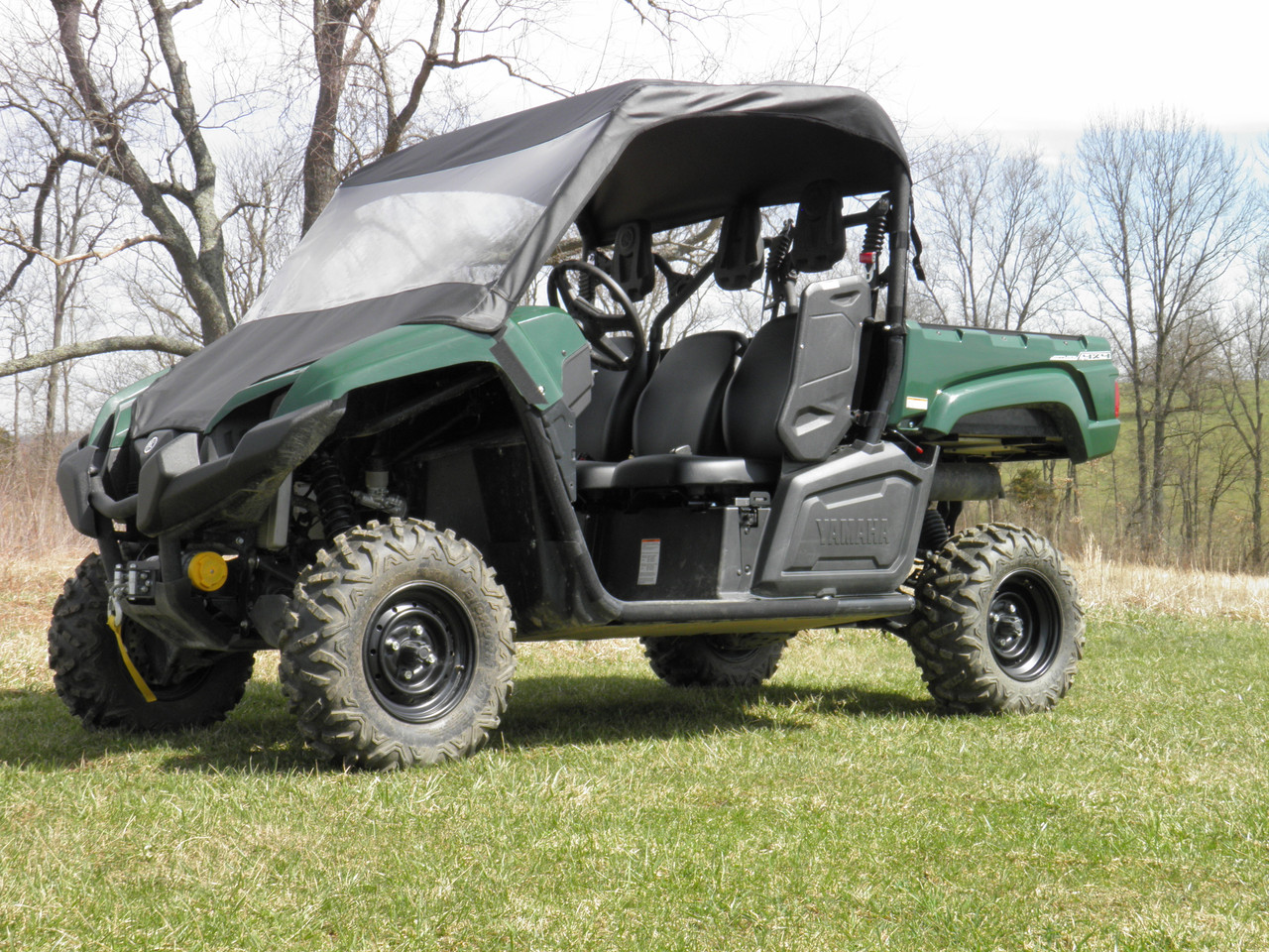 Passenger side front three-quarter view of a green Yamaha Viking with the 3 Star vinyl windshield and top installed