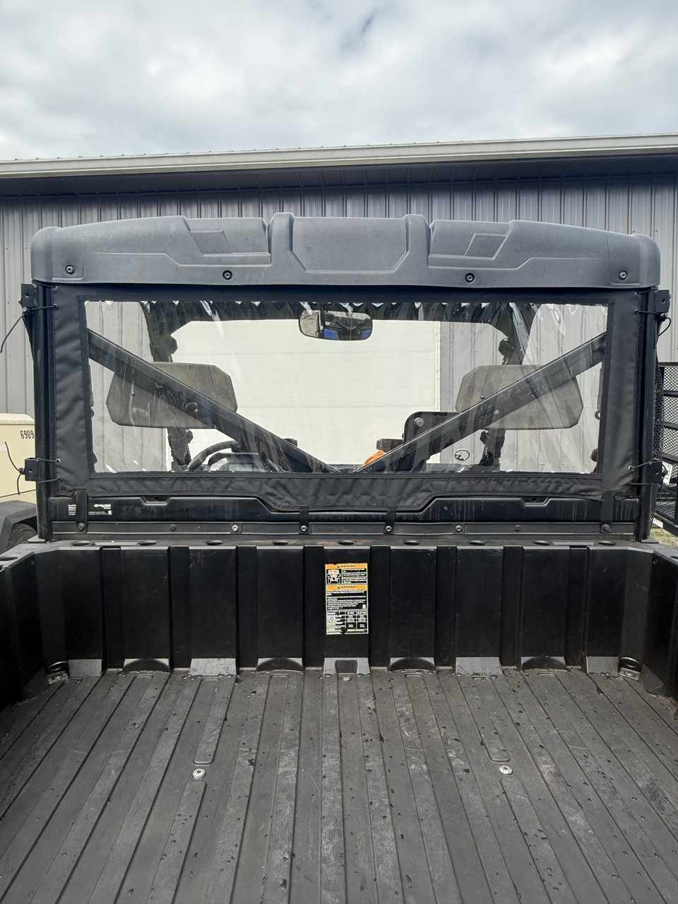 Greene Mountain rear windjammer with clear window on a Polaris Ranger XP 900/1000, seen from directly behind
