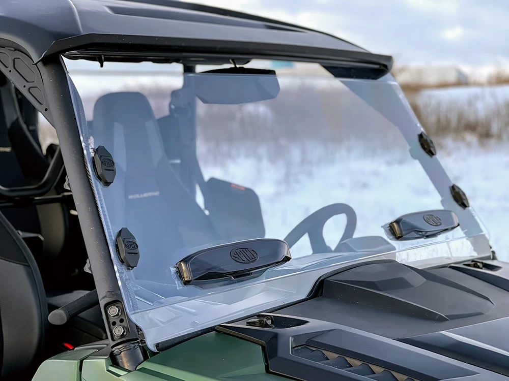 Spike windshield for Yamaha Wolverine RMAX: windshield vents on a green UTV, close side angle
