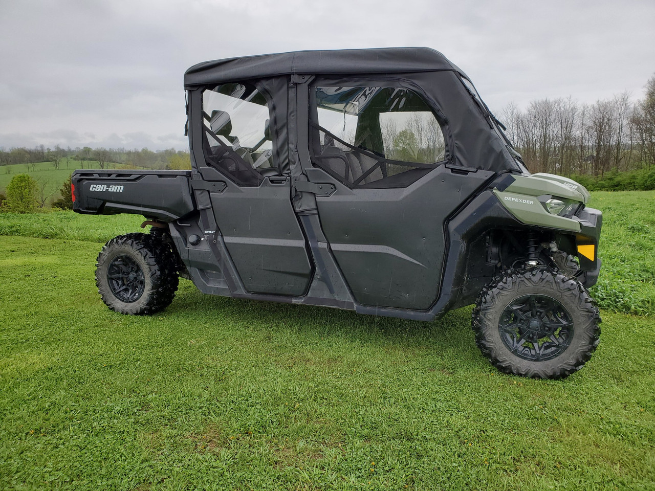 3 Star soft half doors and rear window combo on a green Can-Am Defender Max, black doors with clear windows, side view