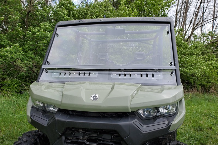Front view of the 3 Star two-piece scratch-resistant windshield with vent slots on a green Can-Am Defender Max