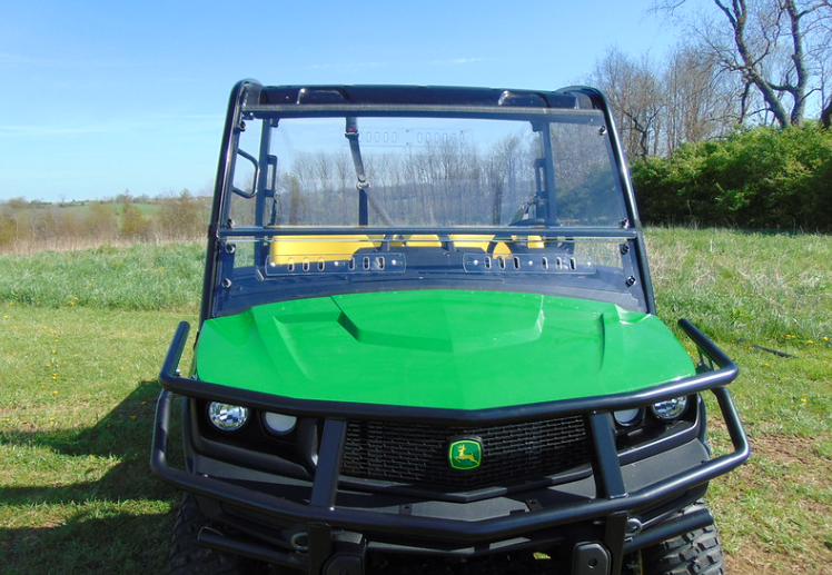 Straight front view of a John Deere XUV 835/865 with the 3 Star two-piece windshield under the roof, brush guard in front