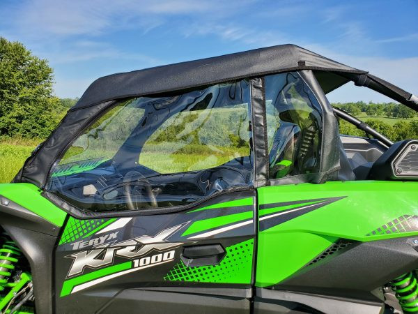 Close-up of the 3 Star soft upper door with clear window on a green Kawasaki KRX, zipper and door frame visible