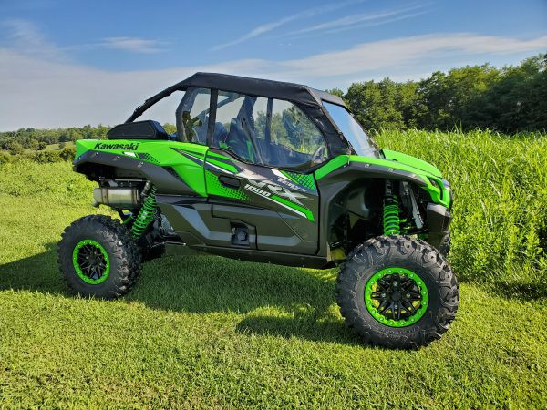 Rear three-quarter view of a green Kawasaki KRX with the 3 Star full cab enclosure and rear window fitted